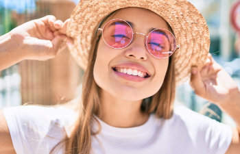 smiling girl in pink glasses and hat, Indian Land, SC